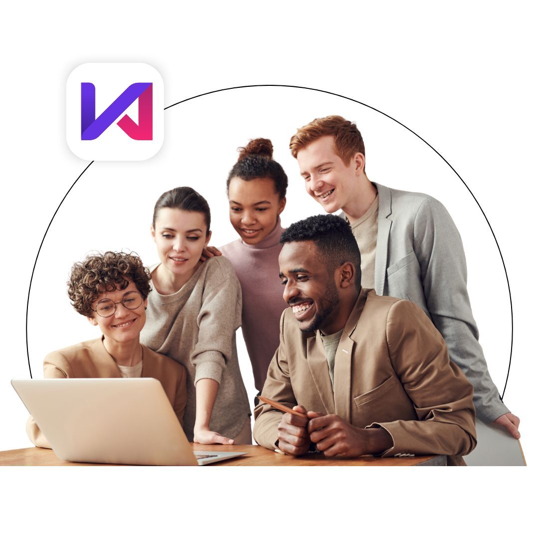 Team surrounding a laptop smiling Team surrounding a laptop smiling
